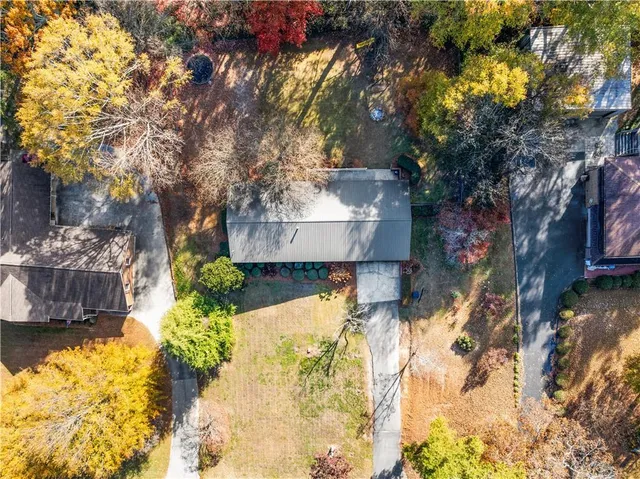 a view of a house with a yard covered with snow