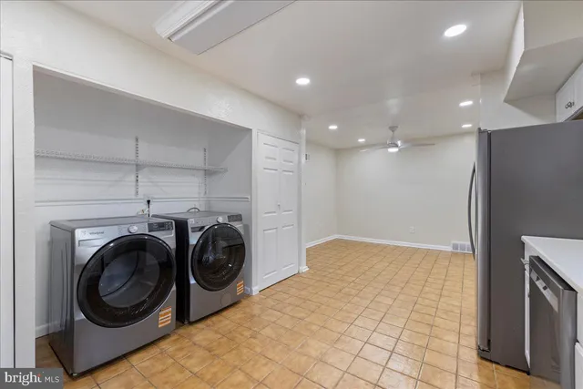 a view of a hallway with washer and dryer