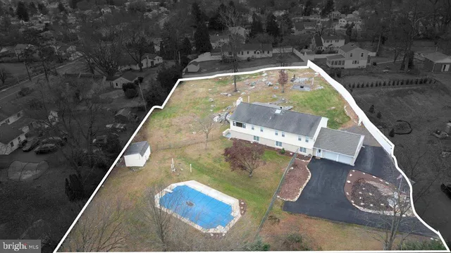 swimming pool view with a sitting space