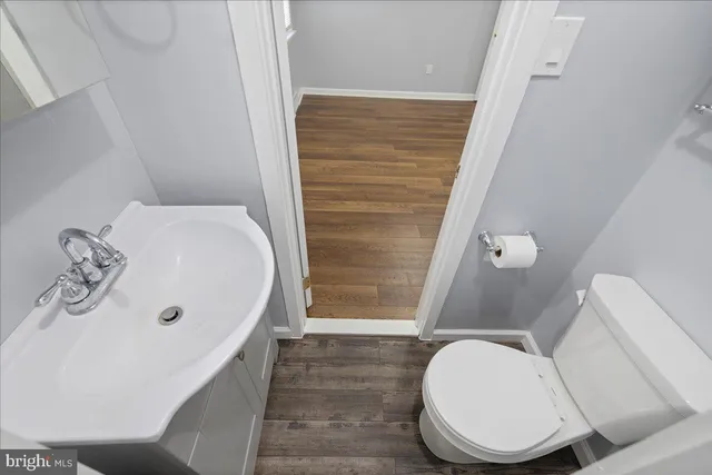 a bathroom with a toilet a sink and bathtub