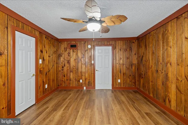 a view of gallery with wooden floor