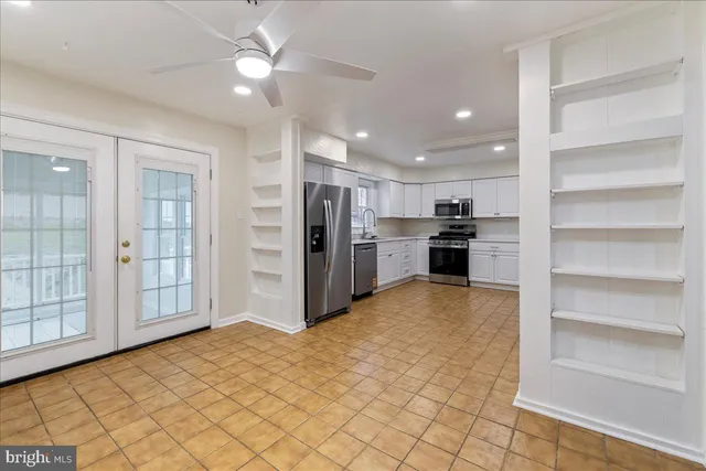 a view of a kitchen with a stove cabinets and a kitchen