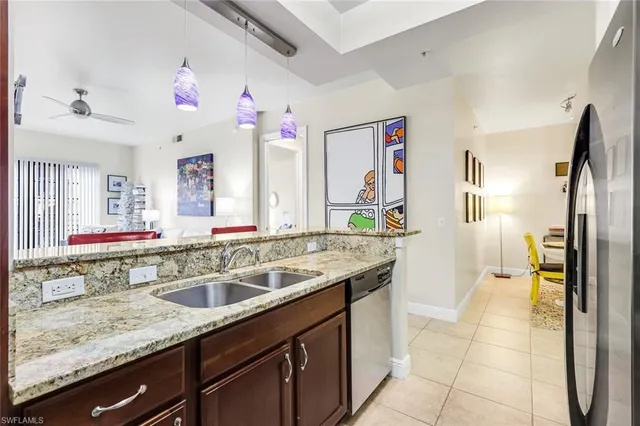 a kitchen with a sink stove and refrigerator