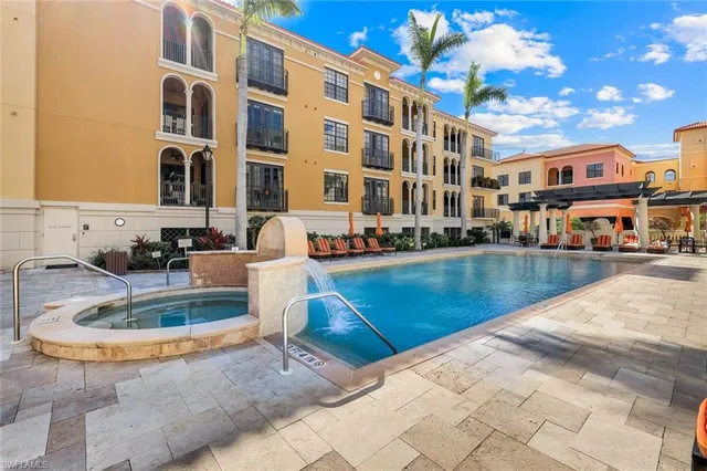 a view of pool with outdoor seating