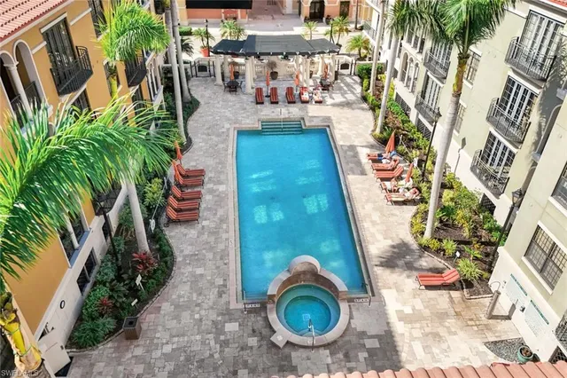 a backyard of a house with outdoor seating