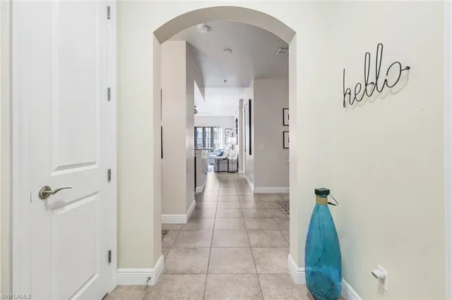 a view of a hallway with a dining area