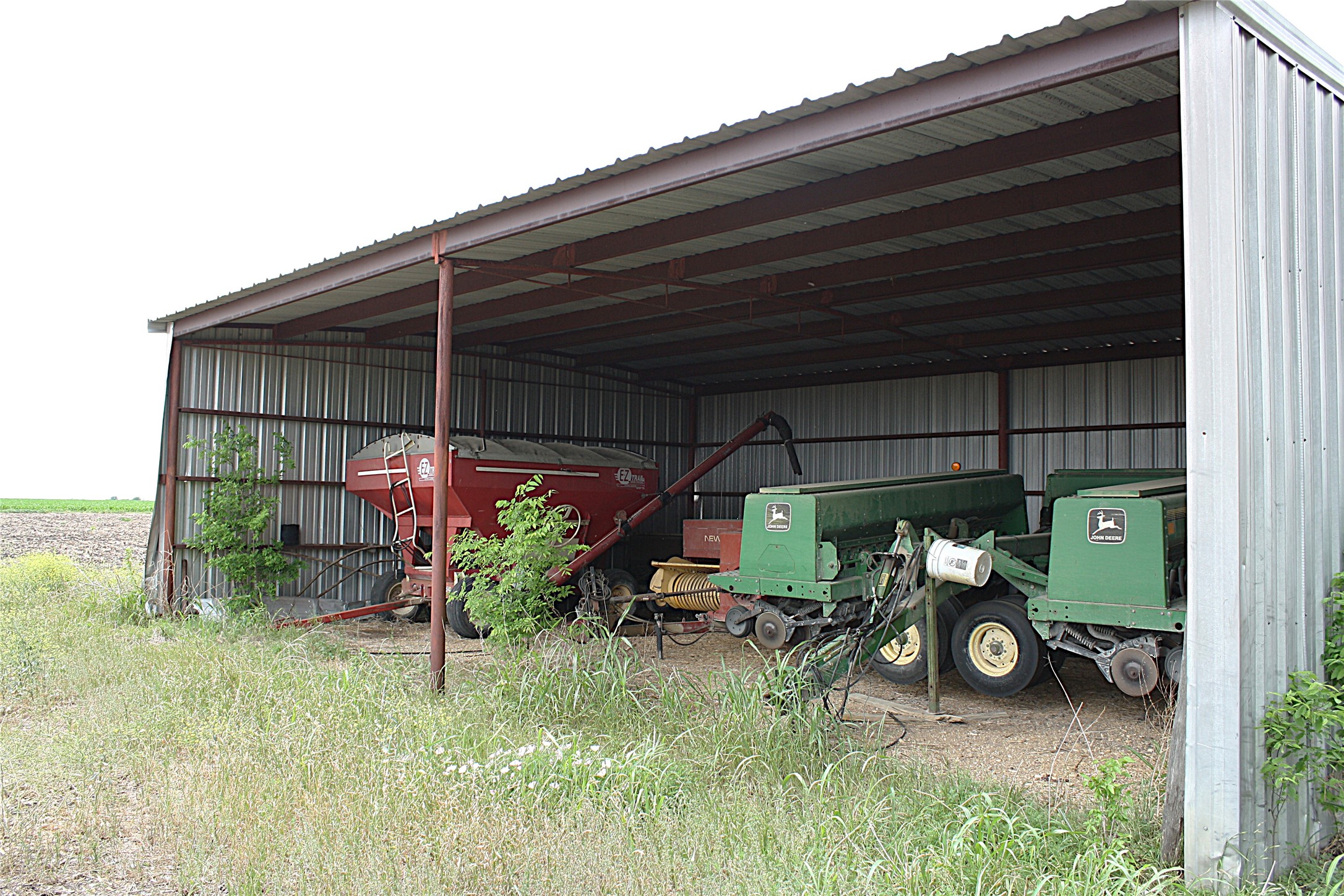19374 Pennington Branch Road Holland, TX 76534 - Photo 16 of 24 The property features a large metal shed with an open side, providing ample covered storage space