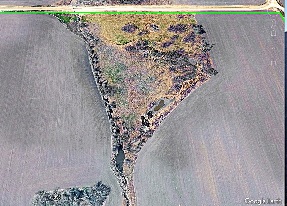 19374 Pennington Branch Road Holland, TX 76534 - Photo 2 of 24 Aerial view of the property showcasing expansive cleared land and areas with natural vegetation, including a visible water feature