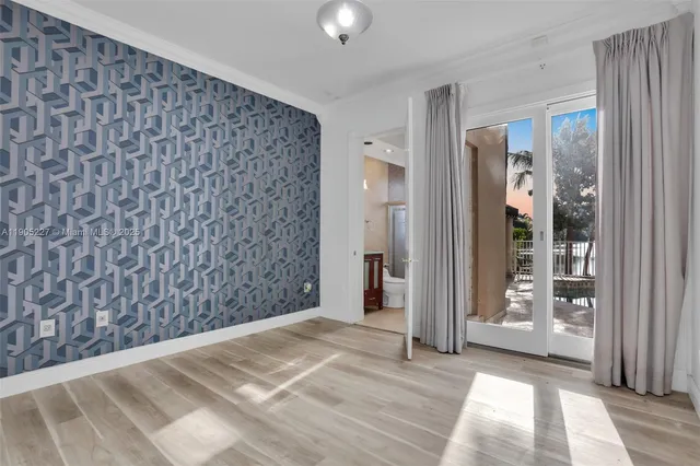 a view of empty room with windows