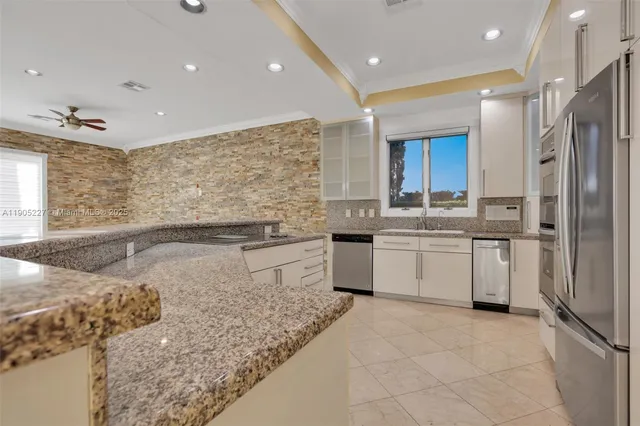 a view of lobby with workspace and windows
