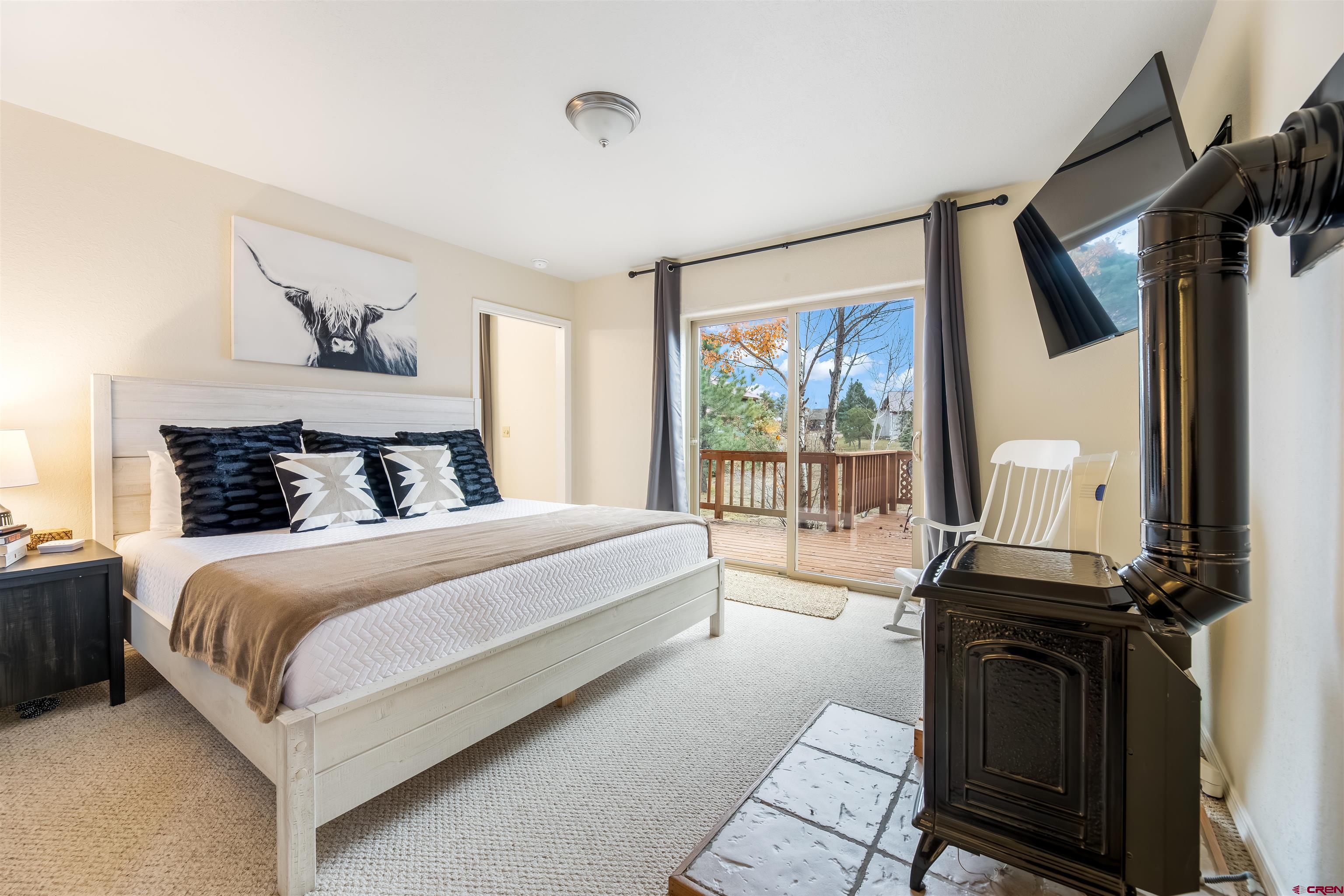 39 Hawk Place Pagosa Springs, CO 81147 - Photo 11 of 37 a bedroom with a bed and wooden floor