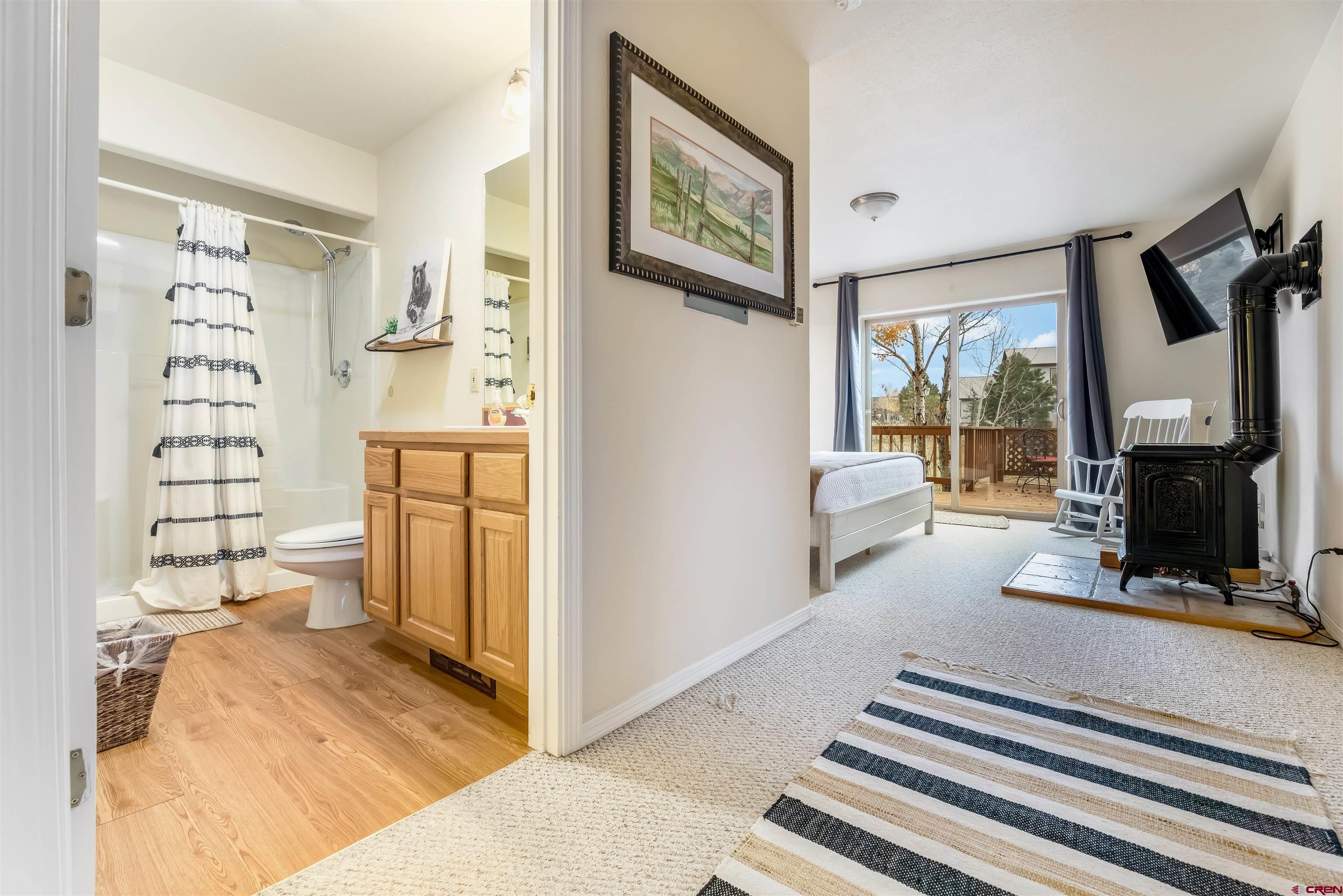 39 Hawk Place Pagosa Springs, CO 81147 - Photo 12 of 37 a living room with furniture and a fireplace