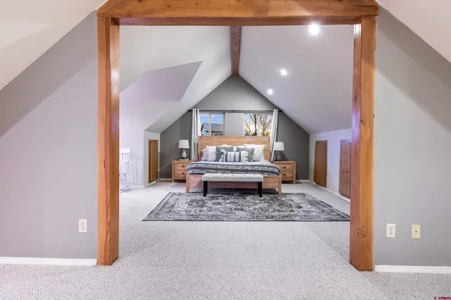 a living room with a couch and a rug