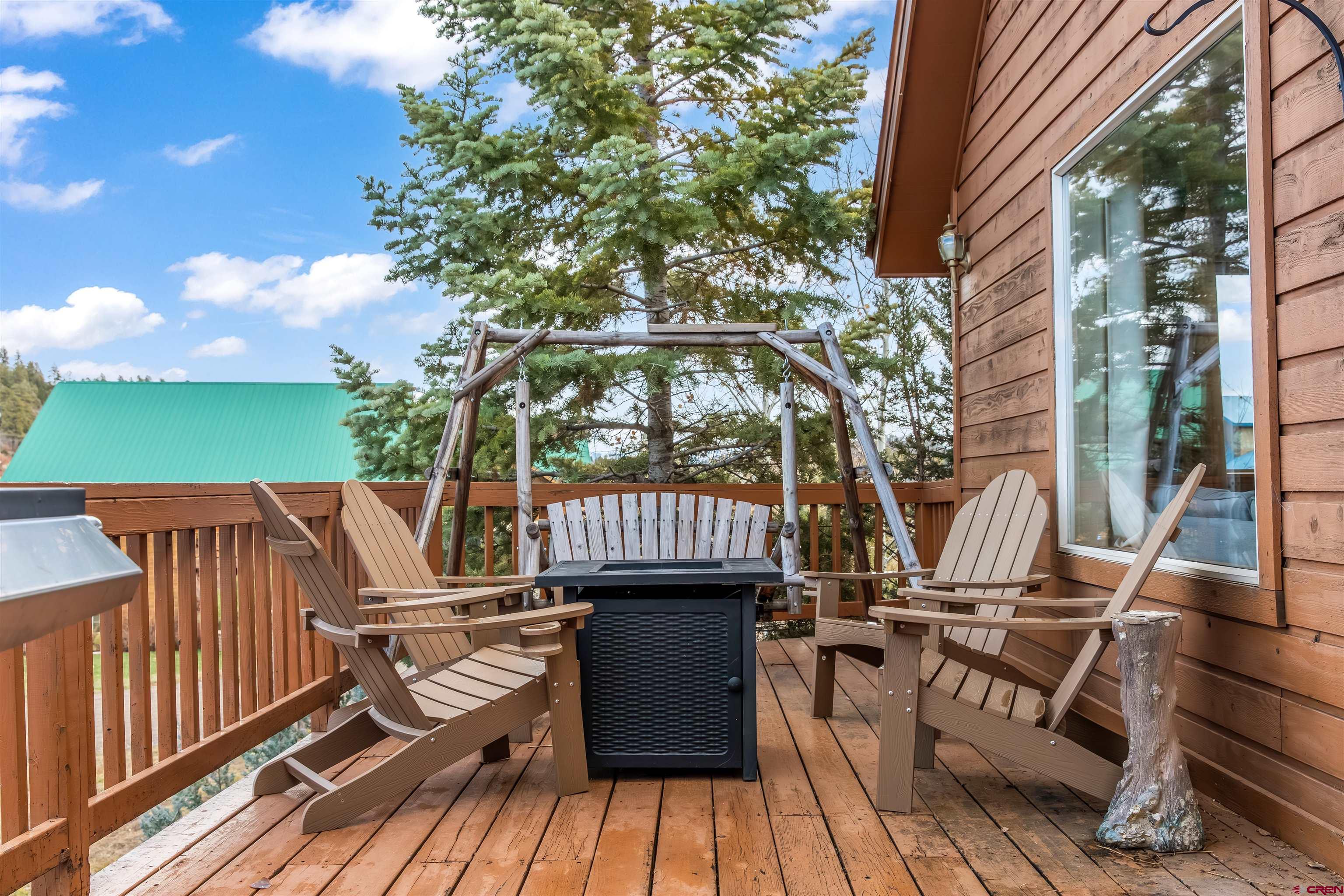 39 Hawk Place Pagosa Springs, CO 81147 - Photo 24 of 37 a view of balcony with chairs and wooden fence
