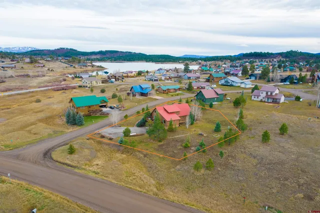 a bathroom with a granite countertop shower and a sink