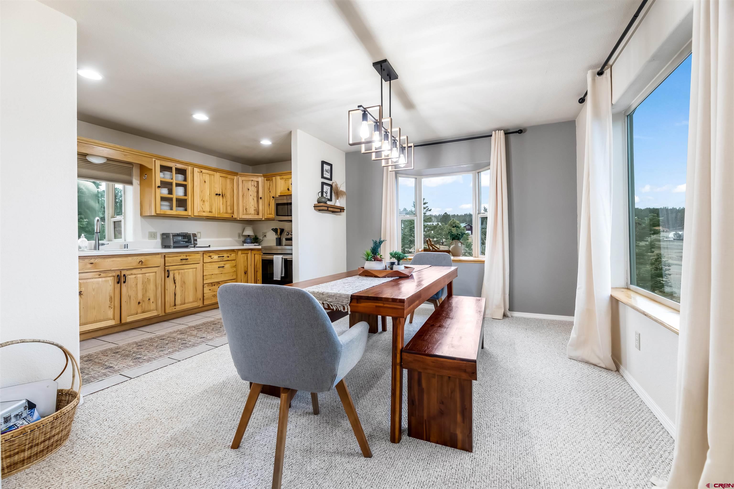 39 Hawk Place Pagosa Springs, CO 81147 - Photo 5 of 37 a view of a dining room with furniture window and outside view