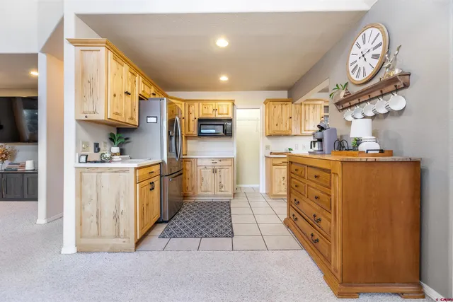 a kitchen with cabinets and a stove