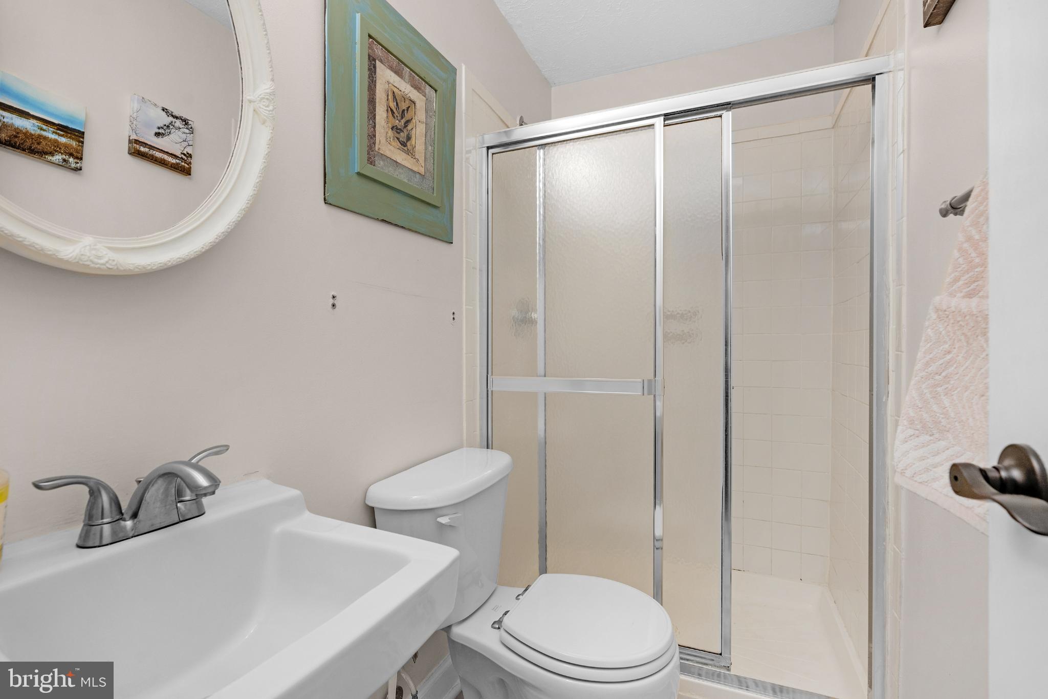 1688 Secretariat Drive Annapolis, MD 21409 - Photo 12 of 20 a white toilet sitting next to a bathroom sink