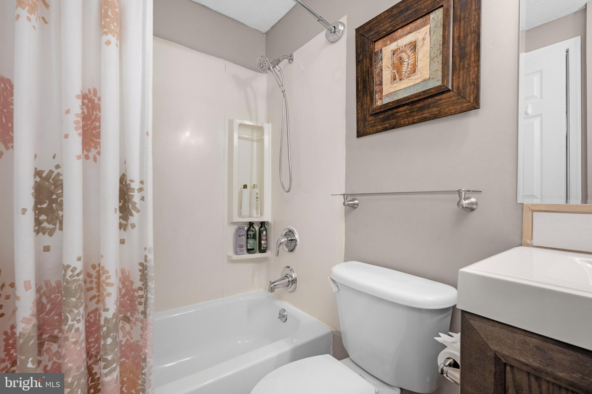 1688 Secretariat Drive Annapolis, MD 21409 - Photo 16 of 20 a white toilet sitting next to a bath tub