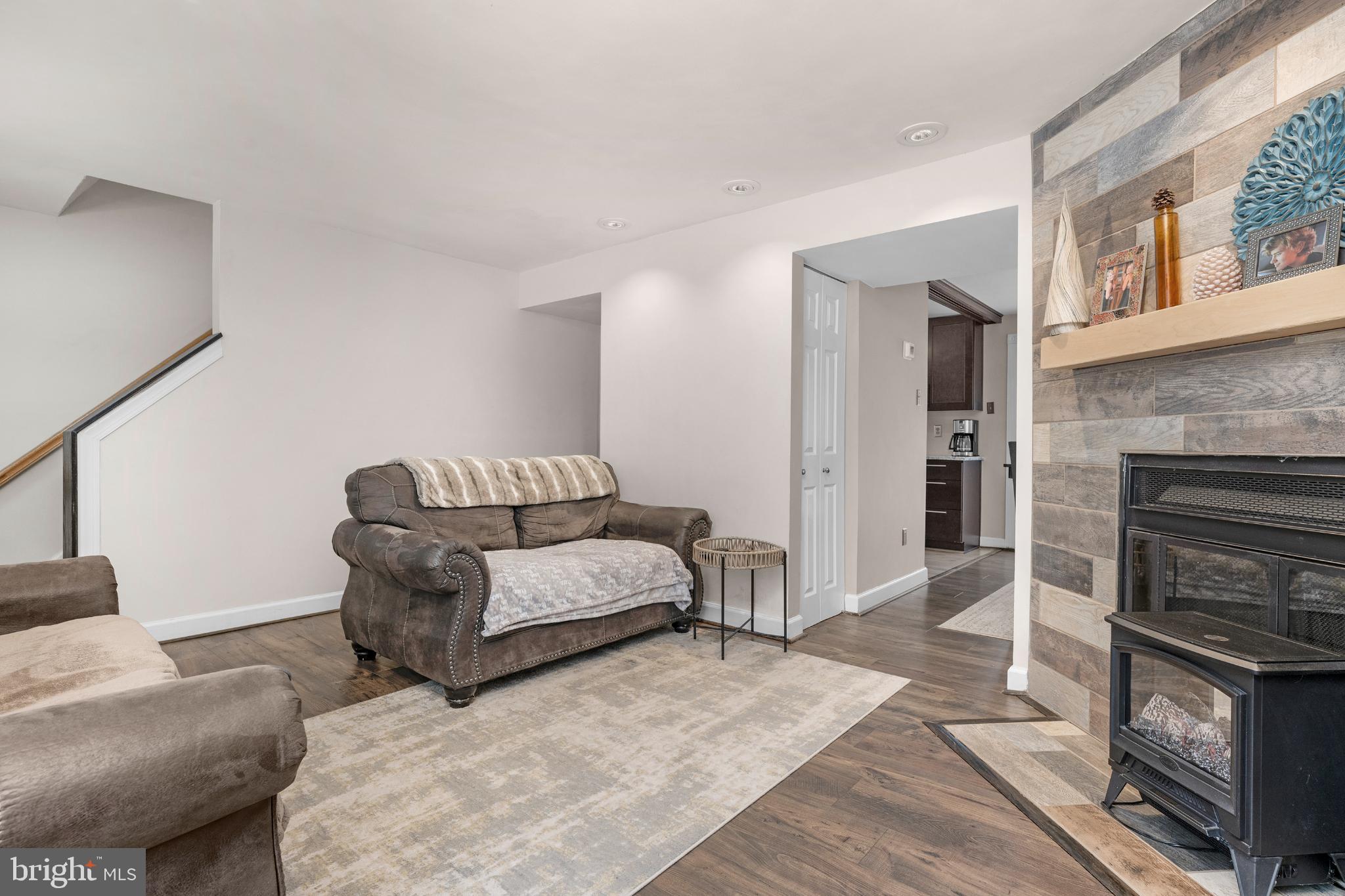 1688 Secretariat Drive Annapolis, MD 21409 - Photo 4 of 20 a living room with furniture and a fireplace