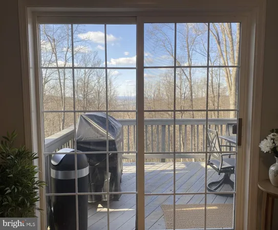 a room with glass door and glass windows