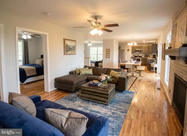 a living room with furniture and a fireplace