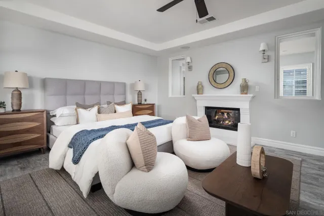 a bedroom with furniture and a fireplace