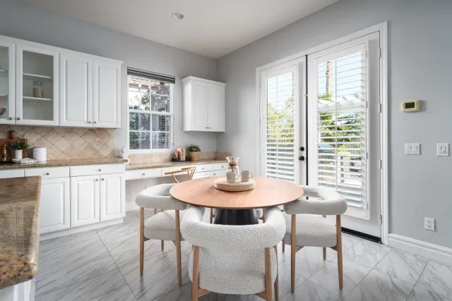 a dining room with furniture and window