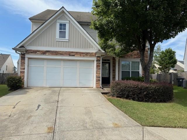 a front view of house with a garden