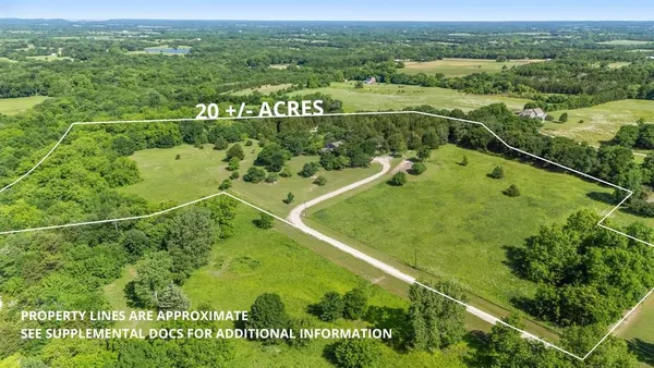 a view of a lake with a yard