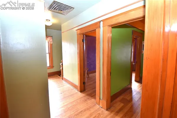 a view of a bathroom from a hallway