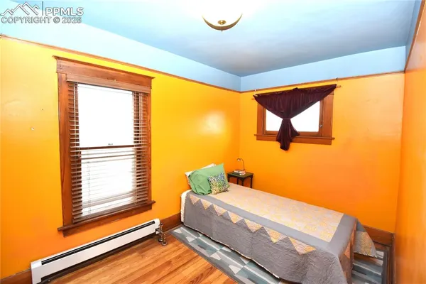 a bathroom with a sink a bathtub and a window