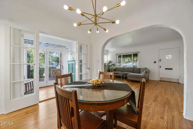 a kitchen with stainless steel appliances granite countertop a sink counter space cabinets a stove and a window