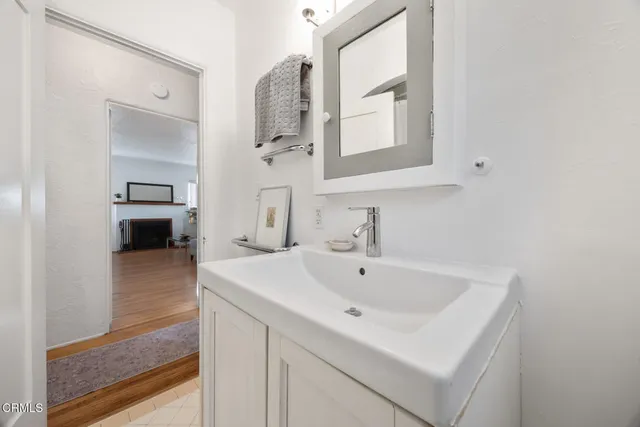 a view of balcony with wooden floor