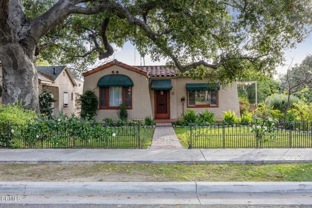 front view of a house with a garden