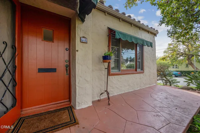 a living room with furniture fireplace and a table