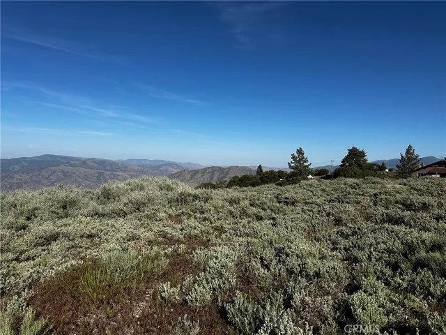 a view of a large building with a mountain in the background