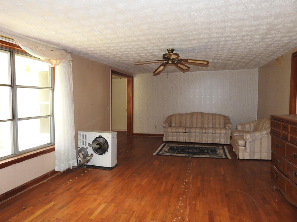 333 Lickskillet Road Epworth, GA 30541 - Photo 16 of 32 a bedroom with a bed and a window