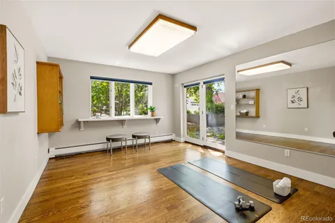 a living room with furniture rug and window