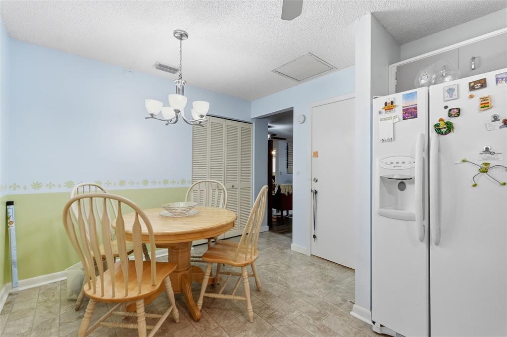 8556 Southwest 90th Lane, Unit F Ocala, FL 34481 - Photo 17 of 34 a view of a dining room with furniture and wooden floor