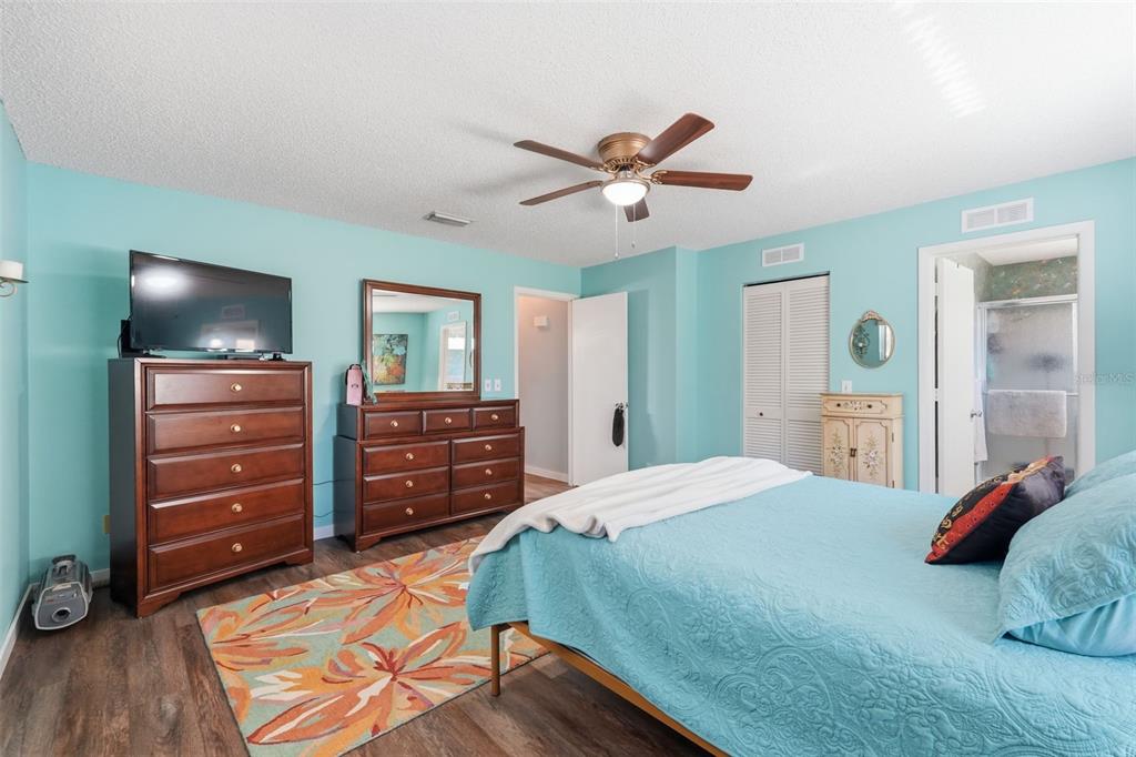 8556 Southwest 90th Lane, Unit F Ocala, FL 34481 - Photo 19 of 34 a bedroom with a bed and furniture
