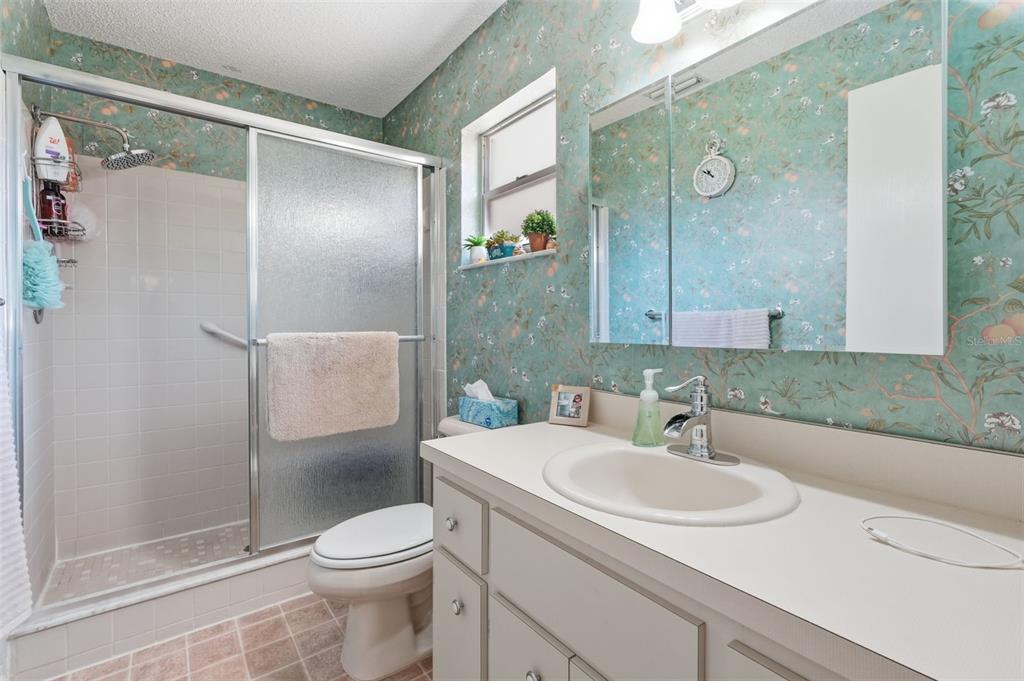 8556 Southwest 90th Lane, Unit F Ocala, FL 34481 - Photo 20 of 34 a bathroom with a sink toilet and shower