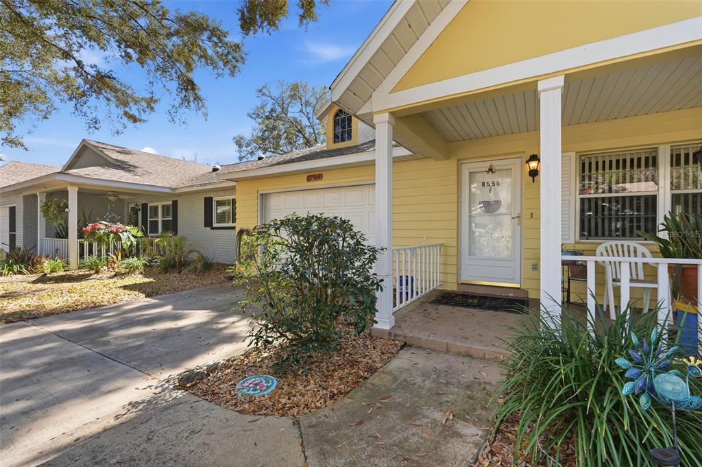8556 Southwest 90th Lane, Unit F Ocala, FL 34481 - Photo 2 of 34 a view of a house with a patio