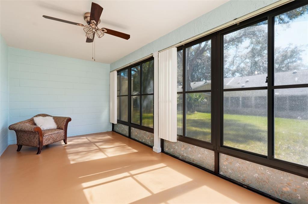 8556 Southwest 90th Lane, Unit F Ocala, FL 34481 - Photo 22 of 34 a living room with a large window