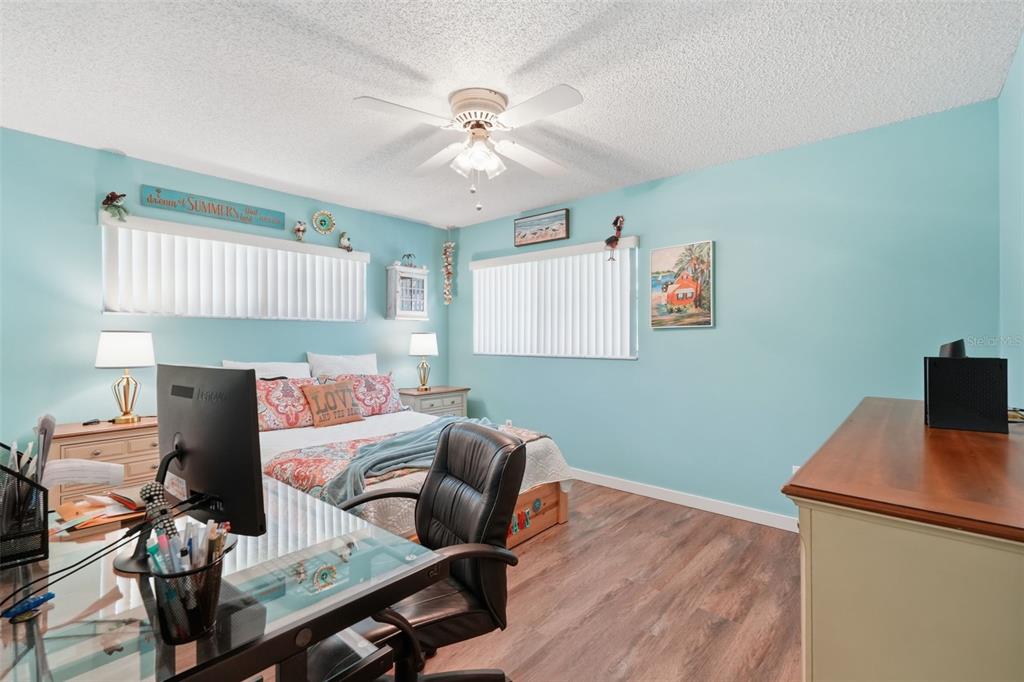 8556 Southwest 90th Lane, Unit F Ocala, FL 34481 - Photo 24 of 34 a living room with furniture and a wooden floor