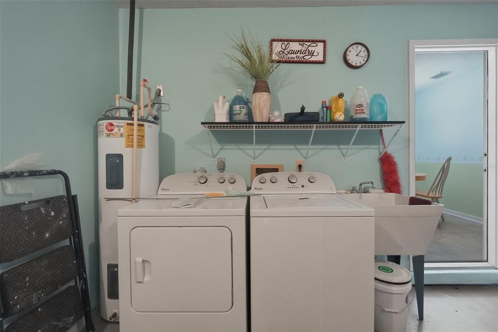 8556 Southwest 90th Lane, Unit F Ocala, FL 34481 - Photo 27 of 34 a utility room with dryer and washer