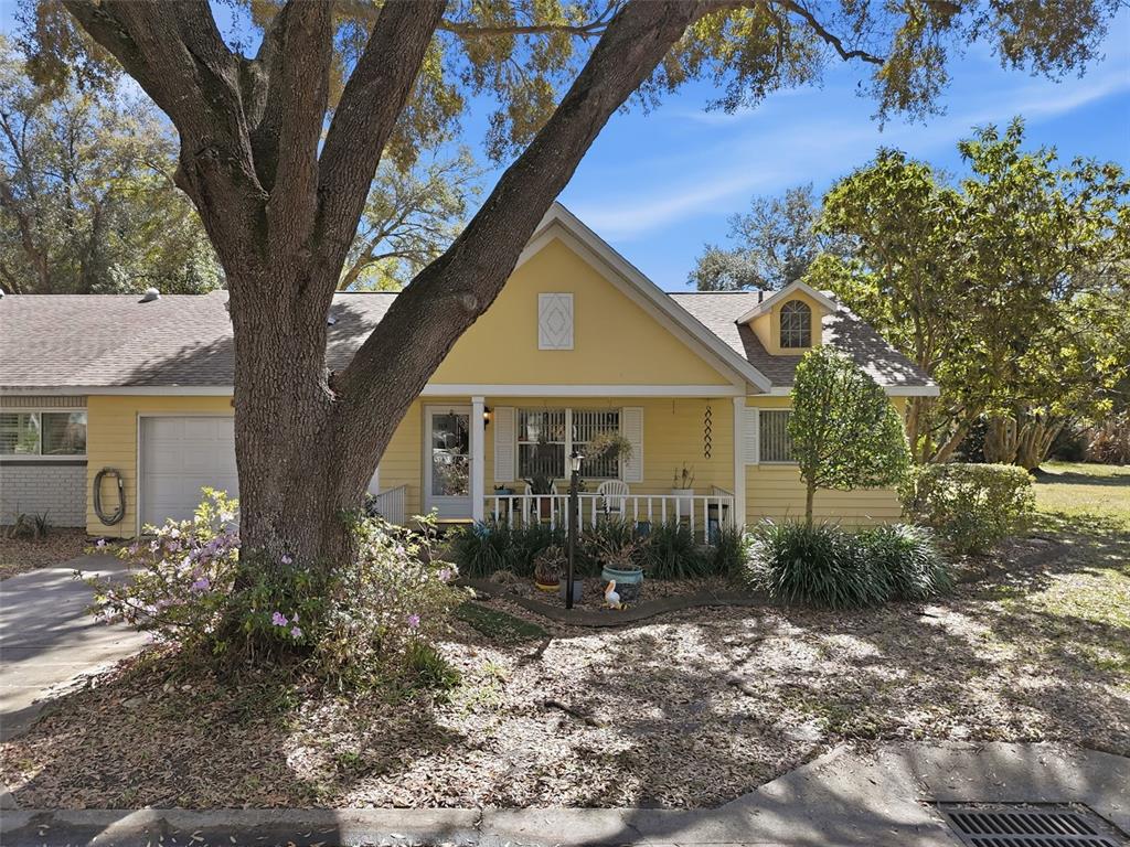 8556 Southwest 90th Lane, Unit F Ocala, FL 34481 - Photo 28 of 34 a front view of a house with garden