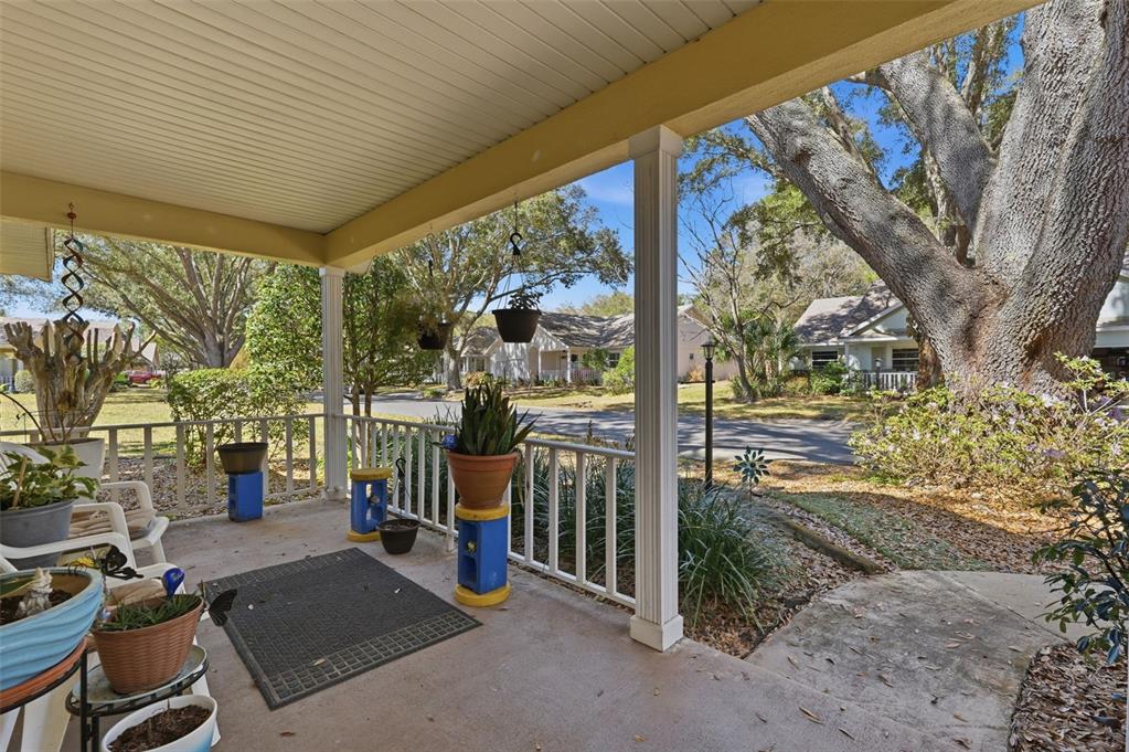 8556 Southwest 90th Lane, Unit F Ocala, FL 34481 - Photo 3 of 34 a view of a porch with furniture