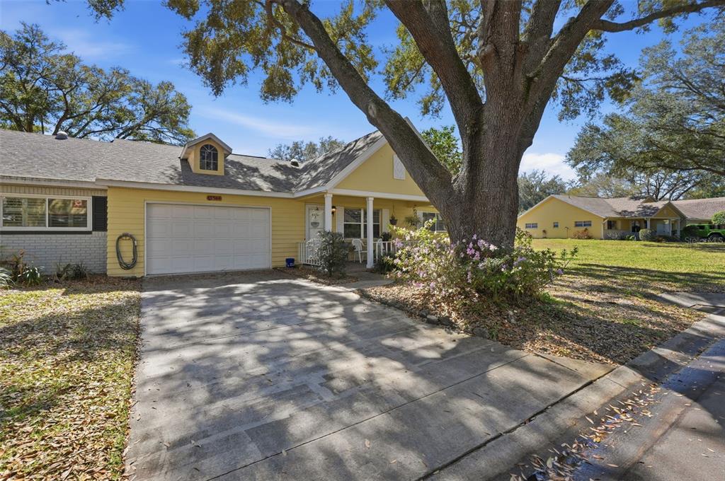 8556 Southwest 90th Lane, Unit F Ocala, FL 34481 - Photo 31 of 34 a view of a house with a yard