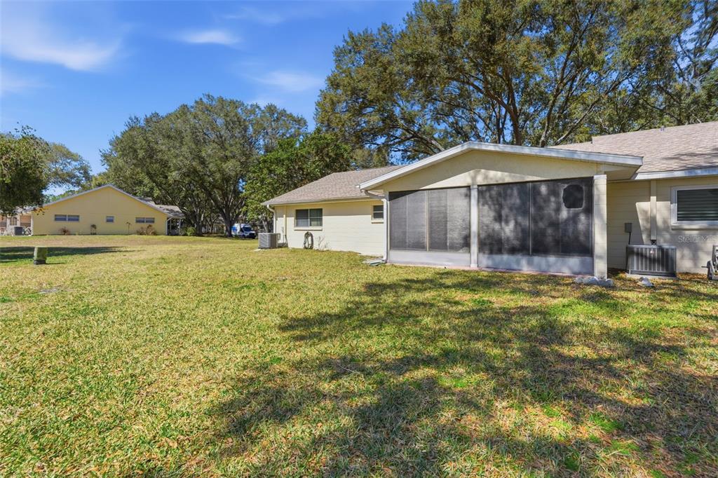 8556 Southwest 90th Lane, Unit F Ocala, FL 34481 - Photo 34 of 34 a front view of a house with garden